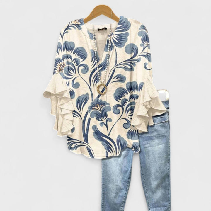 Blusa donna elegante con maniche volant e stampa raffinata