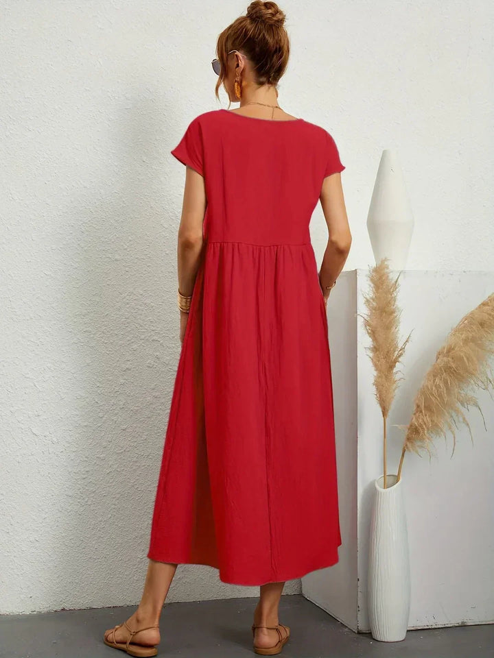 Abito midi elegante fluido e senza tempo per donna