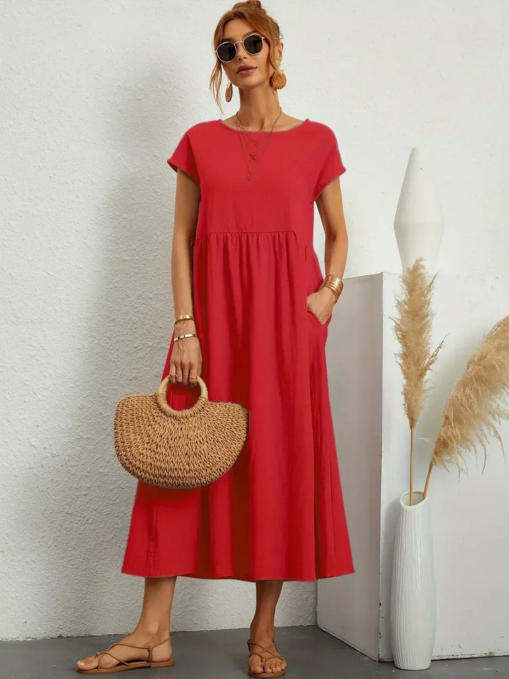 Abito midi elegante fluido e senza tempo per donna