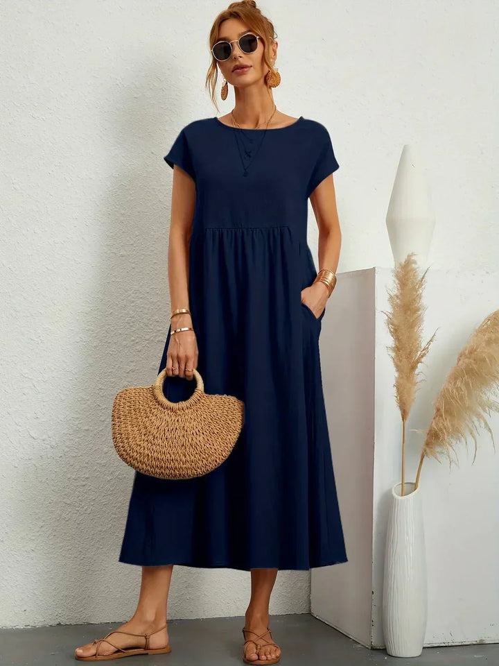 Abito midi elegante fluido e senza tempo per donna