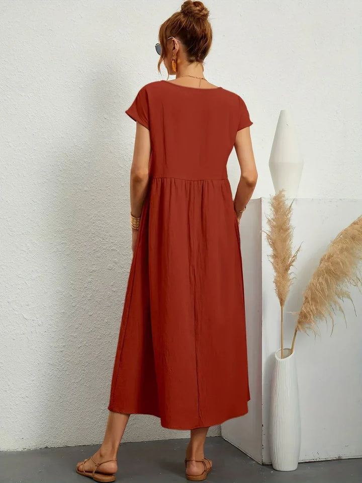 Abito midi elegante fluido e senza tempo per donna