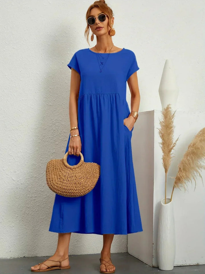 Abito midi elegante fluido e senza tempo per donna
