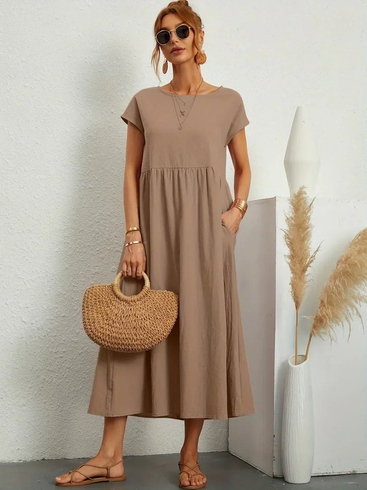 Abito midi elegante fluido e senza tempo per donna