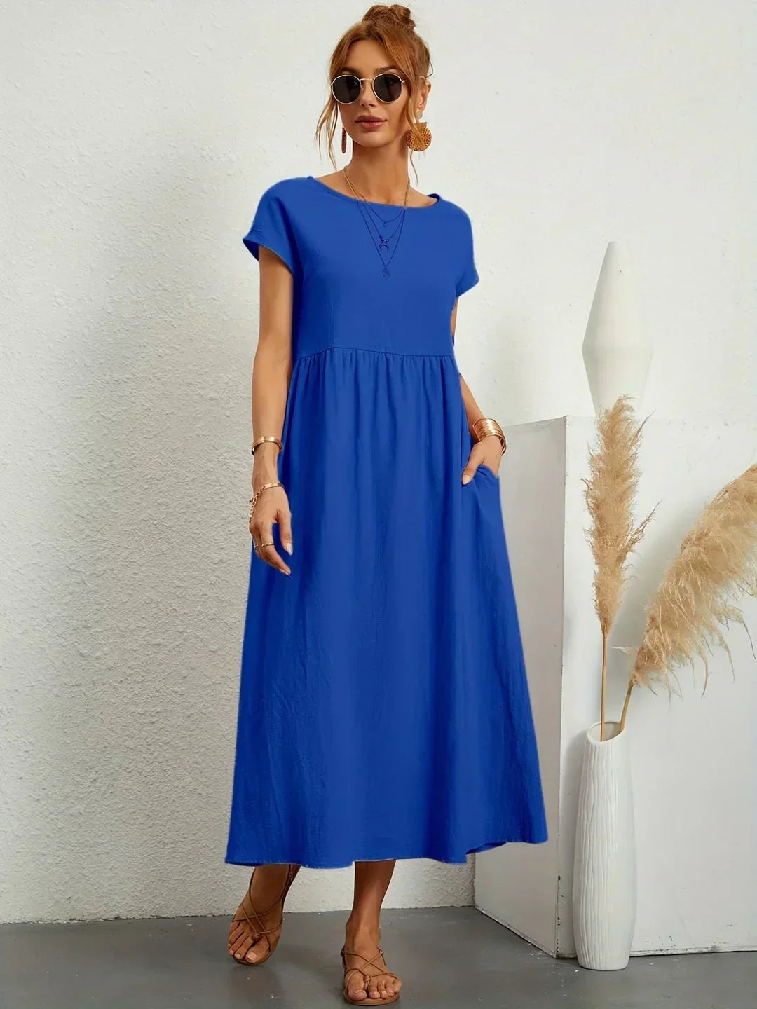 Abito midi elegante fluido e senza tempo per donna