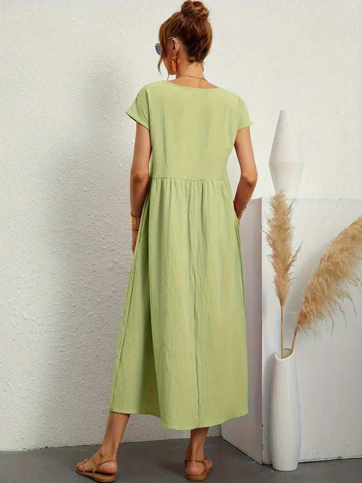 Abito midi elegante fluido e senza tempo per donna