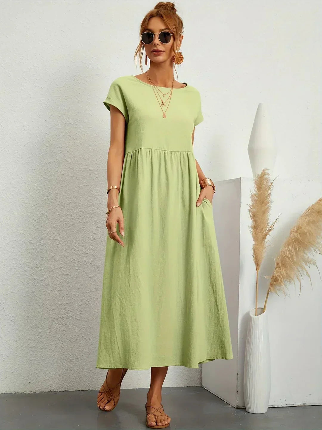 Abito midi elegante fluido e senza tempo per donna