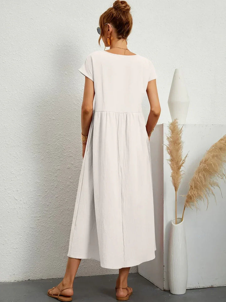 Abito midi elegante fluido e senza tempo per donna