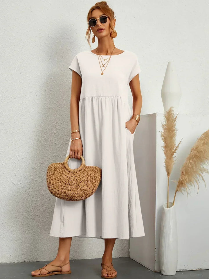 Abito midi elegante fluido e senza tempo per donna