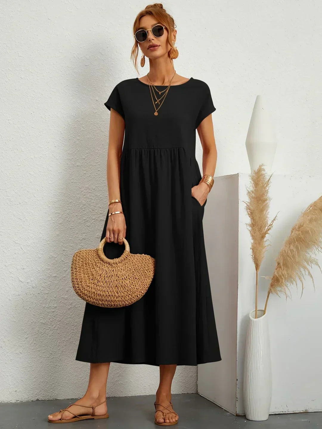 Abito midi elegante fluido e senza tempo per donna