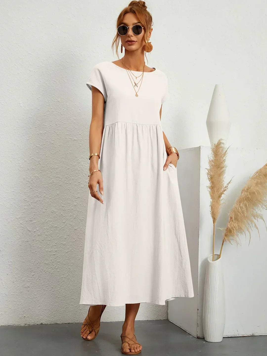 Abito midi elegante fluido e senza tempo per donna