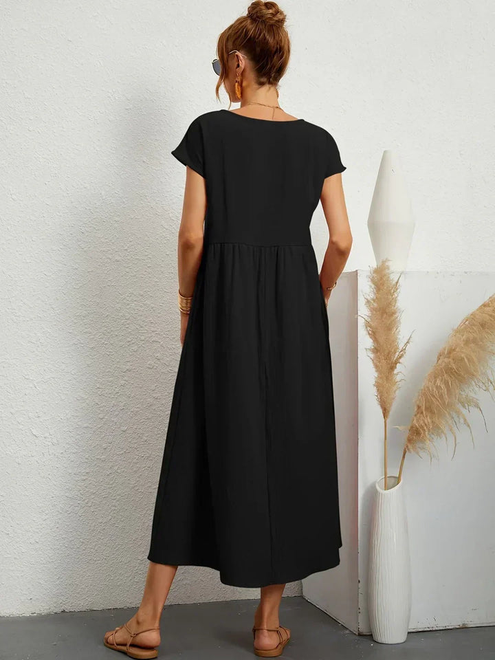 Abito midi elegante fluido e senza tempo per donna