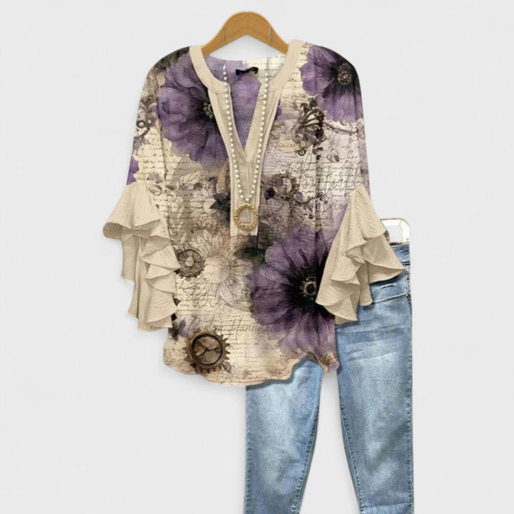 Blusa donna elegante con maniche volant e stampa raffinata