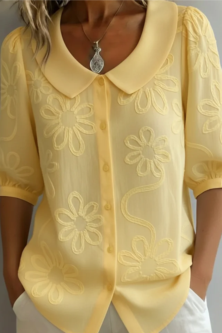 Blusa elegante da donna con collo rotondo e ricamo floreale