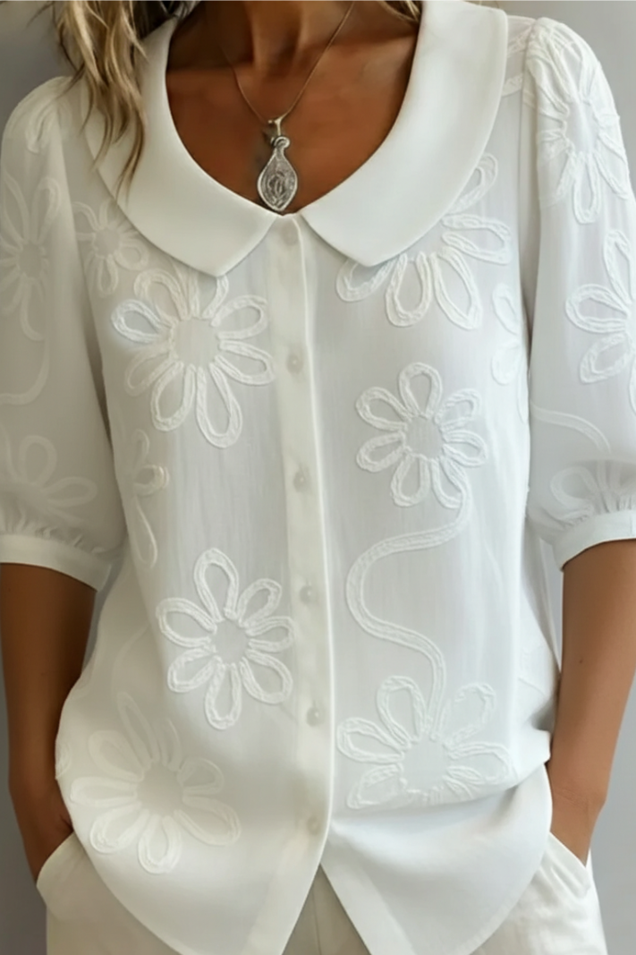 Blusa elegante da donna con collo rotondo e ricamo floreale