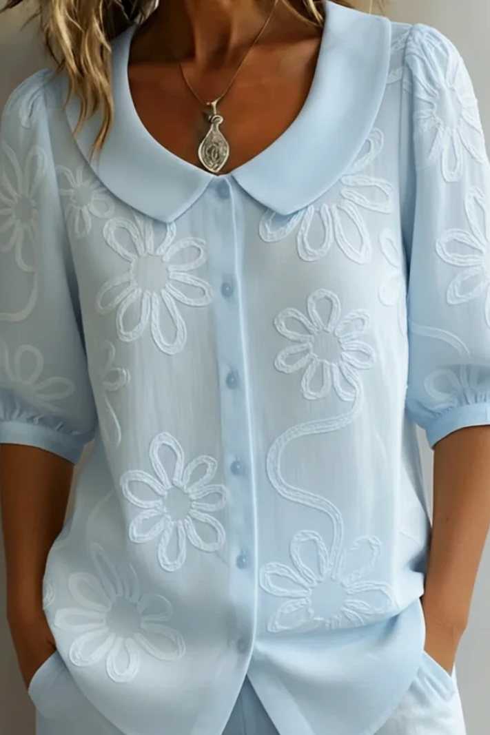 Blusa elegante da donna con collo rotondo e ricamo floreale