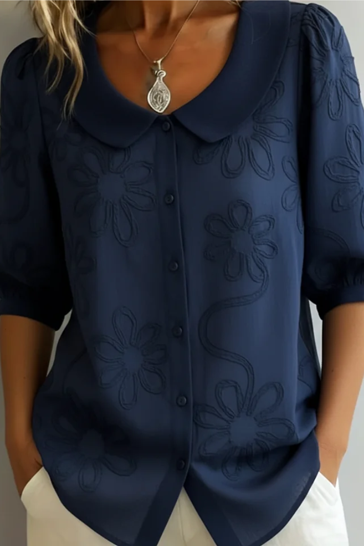 Blusa elegante da donna con collo rotondo e ricamo floreale