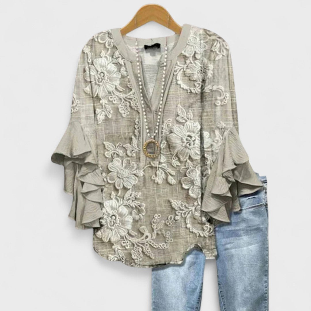 Blusa donna elegante con maniche volant e stampa raffinata