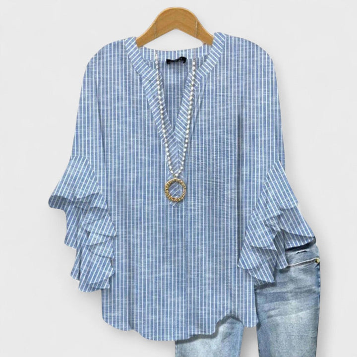 Blusa donna elegante con maniche volant e stampa raffinata
