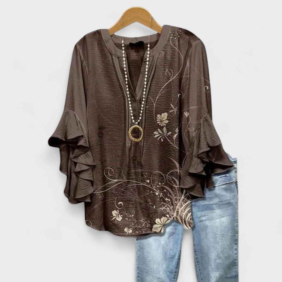 Blusa donna elegante con maniche volant e stampa raffinata