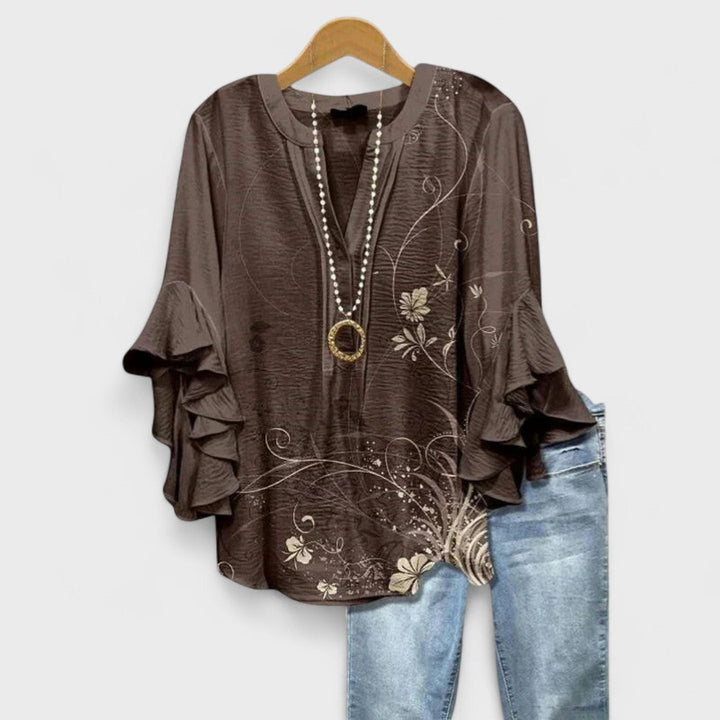 Blusa donna elegante con maniche volant e stampa raffinata