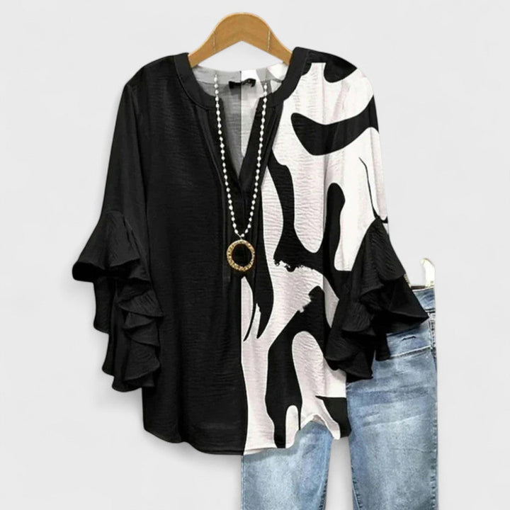 Blusa donna elegante con maniche volant e stampa raffinata