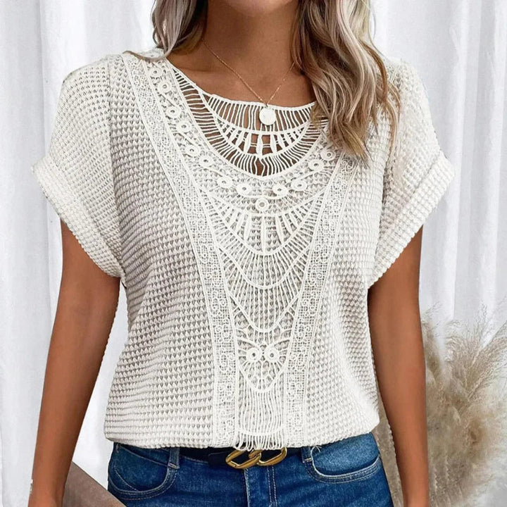 Top elegante in pizzo leggero e traspirante per donna