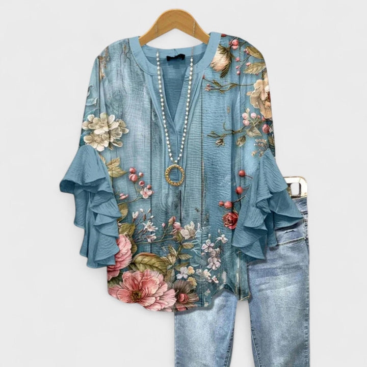 Blusa donna elegante con maniche volant e stampa raffinata