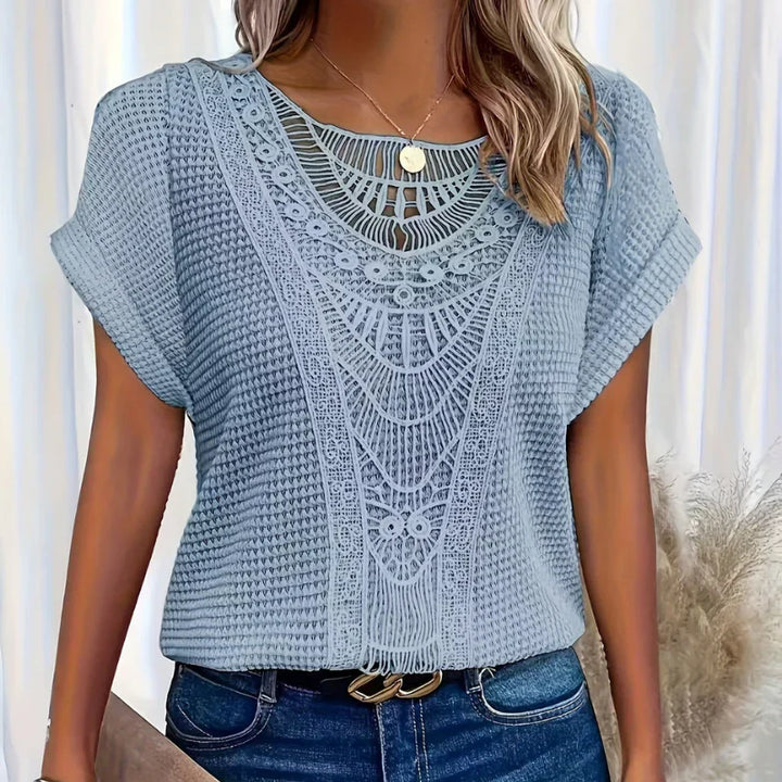 Top elegante in pizzo leggero e traspirante per donna