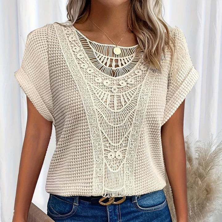 Top elegante in pizzo leggero e traspirante per donna