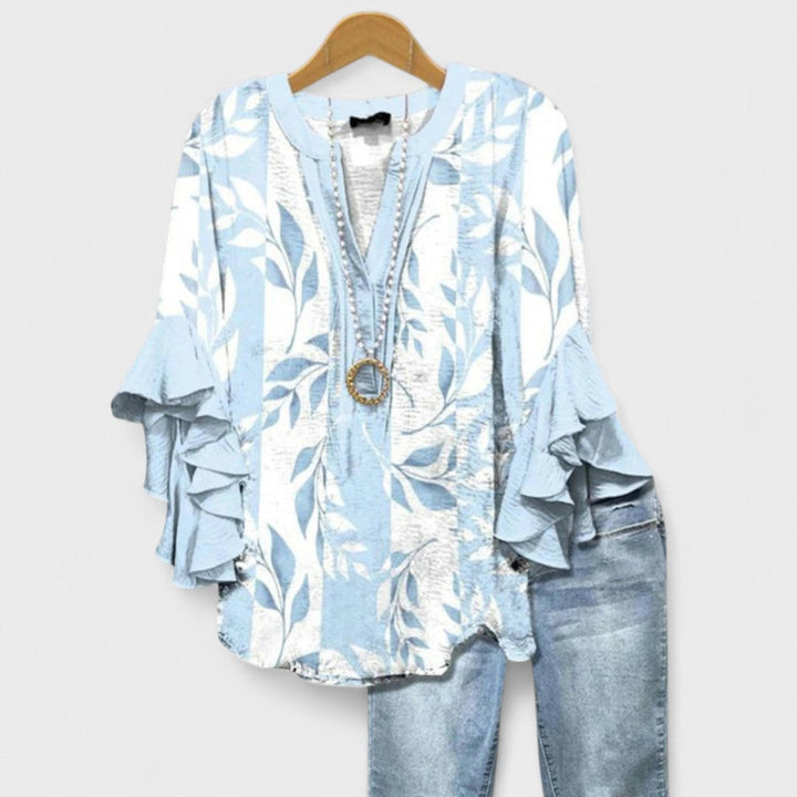 Blusa donna elegante con maniche volant e stampa raffinata