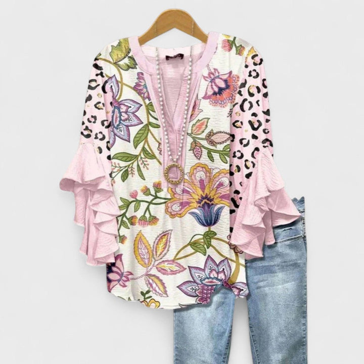 Blusa donna elegante con maniche volant e stampa raffinata