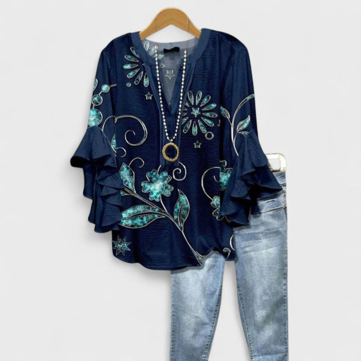 Blusa donna elegante con maniche volant e stampa raffinata
