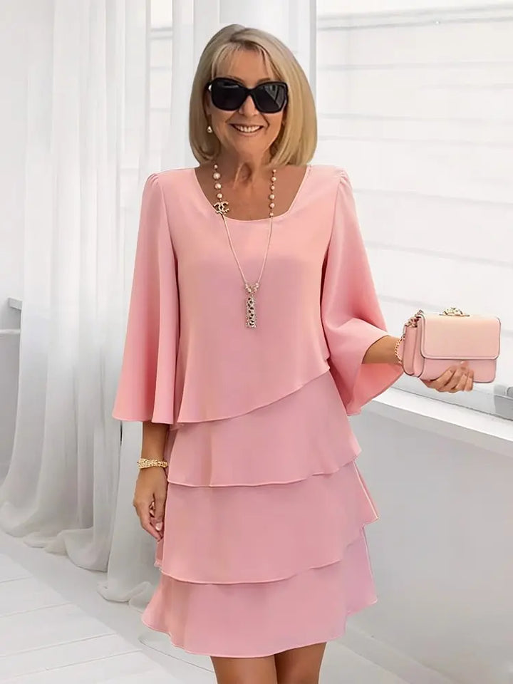 Abito elegante fluido con volant per donna
