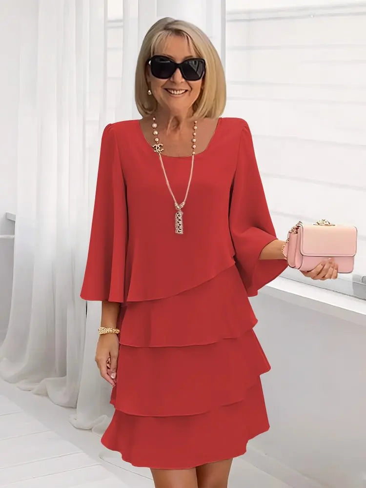 Abito elegante fluido con volant per donna